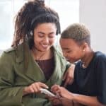 Parent and teen connecting thoughtfully while redefining parenting success