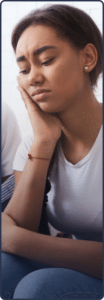 adolescent girl being comforted while in need of mood and thought disorder treatment for teens