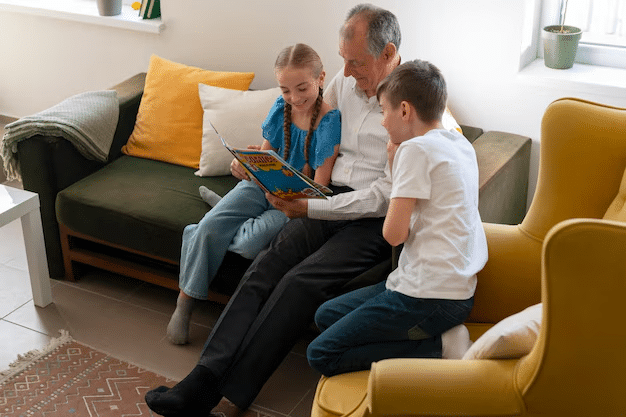 grandfather reading to two grandchildren while providing family support