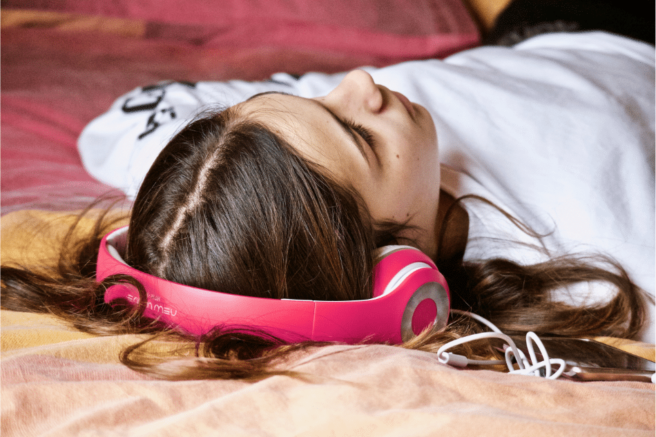 Teen girl listening to music struggling with displaced anger