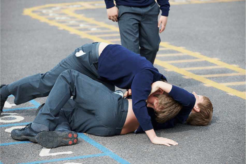 Teen boys fighting on the playground