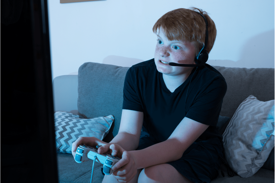 Angry teen with intermittent explosive disorder playing video games