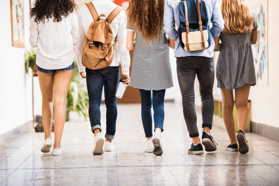Group of friends walking in the school halls