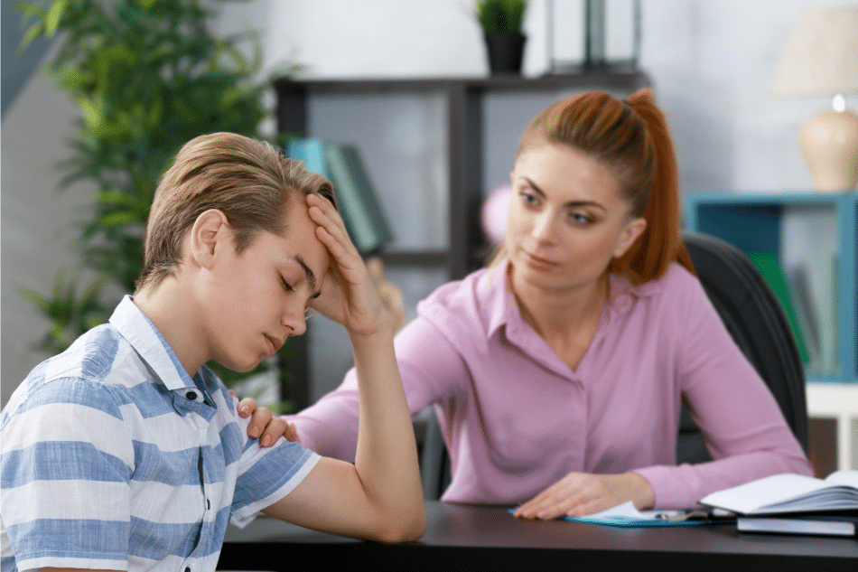 Boy in therapy receiving support for emotional abuse