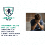 teenage boy with his head in his hands wondering about the treatment plans for DID teens