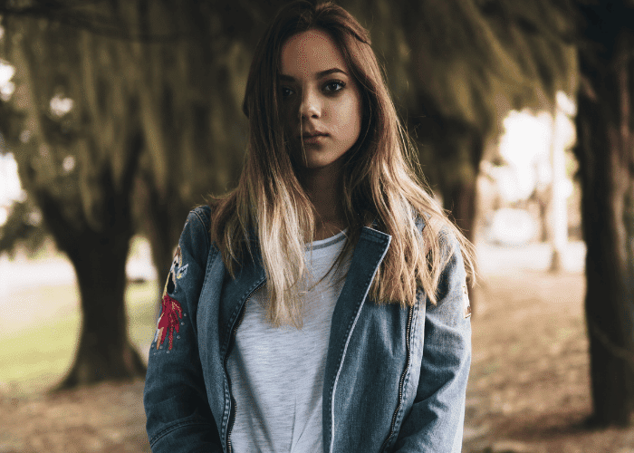 teenage girl looking sad outside wondering about IFS benefits for teens