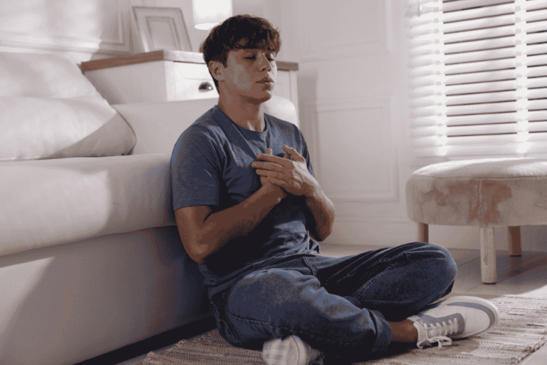 Teenage boy breathing mindfully for mindfulness-based cognitive therapy