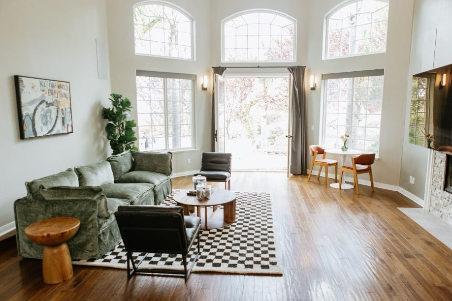 Bright therapy office of Mission Prep with green velvet sofa, and warm natural lighting