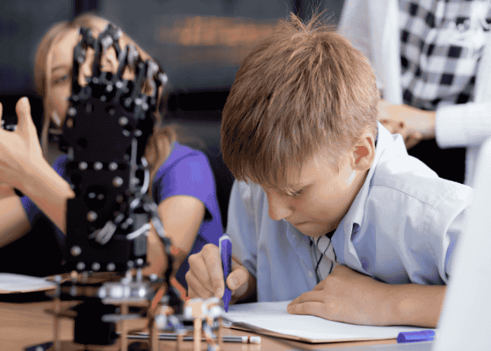 teenage boy completing school work at a desk struggling with cognitive issues in teens