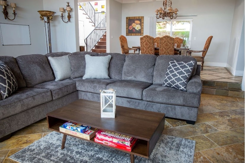 Modern living room of Mission Prep with a gray sectional sofa.