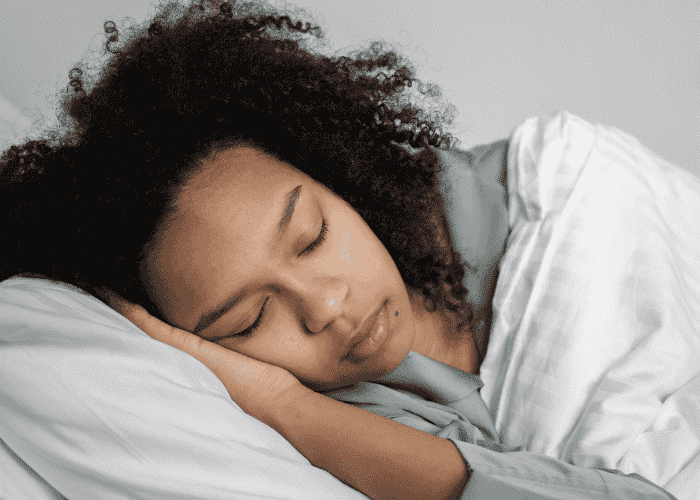 Teenage girl sleeping soundly after receiving treatment for teen insomnia