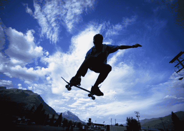 teenage boy skateboarding at a height struggling with teen impulsivity
