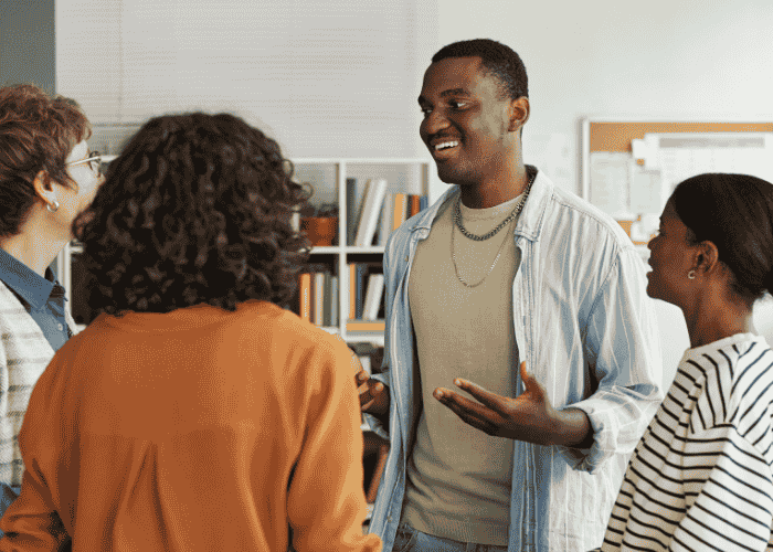 Group of teenagers talking happily after receiving treatment for rigid thinking in youth