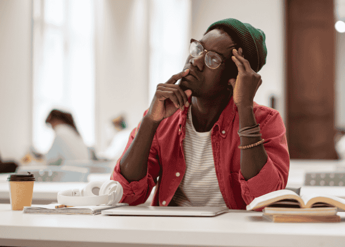 Teenage boy looking up in confusion, struggling with teen confusion & misremembering