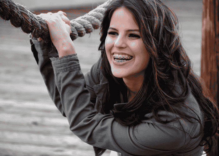 Teenage girl smiling after receiving treatment for teen confusion & misremembering