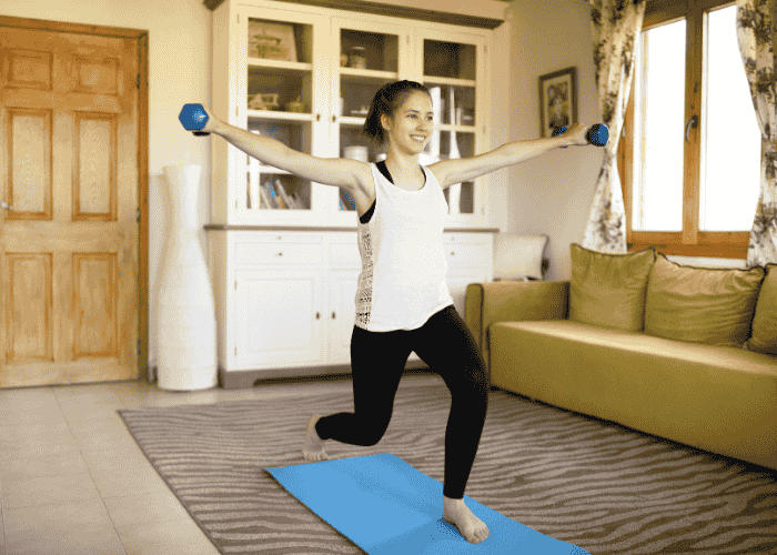 Teenage girl exercising with a smile on her face due to treatment for anxiety & feeling faint in teens