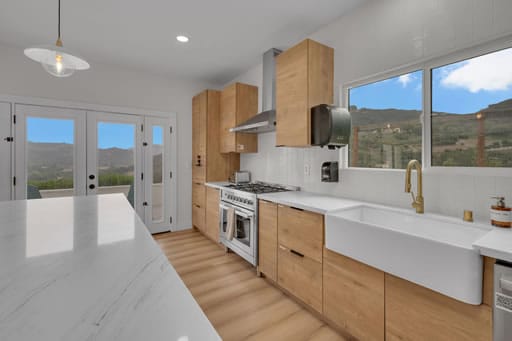 Modern bright kitchen with large windows