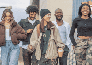 Group of youth walking and laughing after planning California youth mental health campaigns