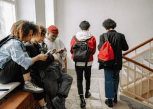 Teenagers in the hallway at school talking about youth mental health in Virginia