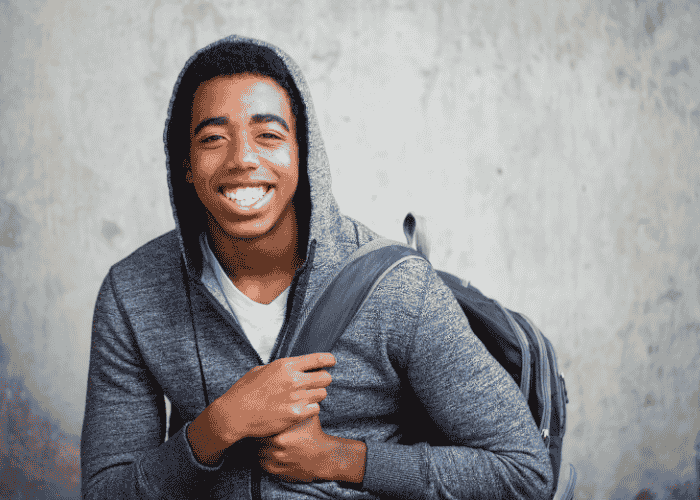 Teenage boy outside smiling after introduction of Virginia’s new screen time law