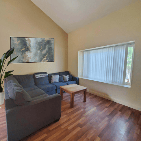 Mission Prep Healthcare residential treatment facility featuring a calm, comfortable common area with natural lighting where teens receive specialized mental health care and therapy.