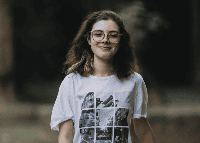 Teenage girl smiling after receiving treatment for how trauma shapes the brain