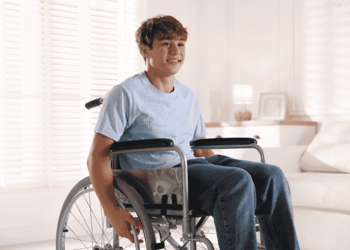Teenage boy smiling after receiving treatment for the 10 signs of c-ptsd