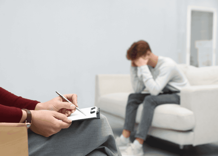 Teenage boy in therapy after experiencing developmental trauma in teens