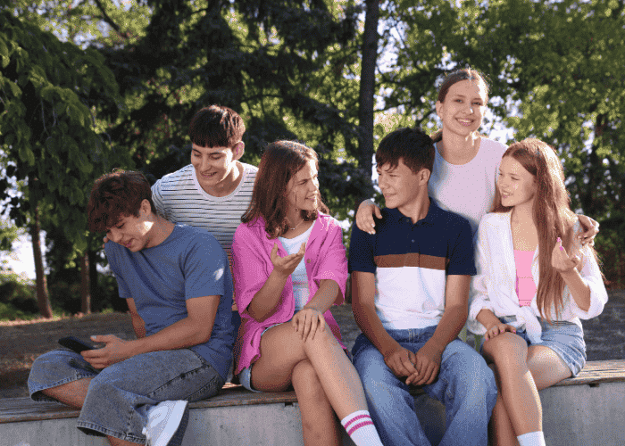 Group of teenagers happy after receiving treatment for trauma and identity development