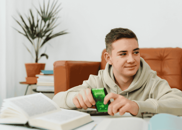 Teenage boy smiling after receiving support for autism and trauma in teens