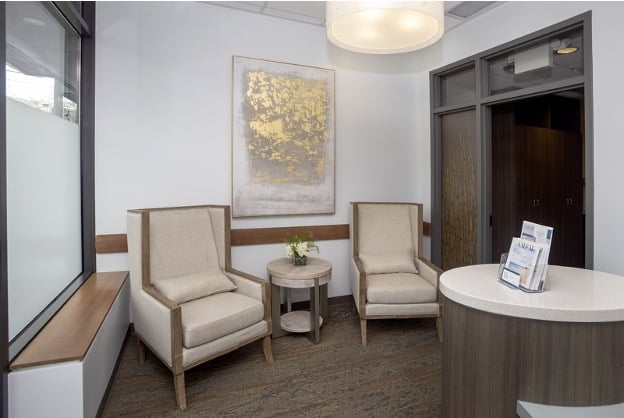 Mission Prep modern office waiting area with two beige armchairs.