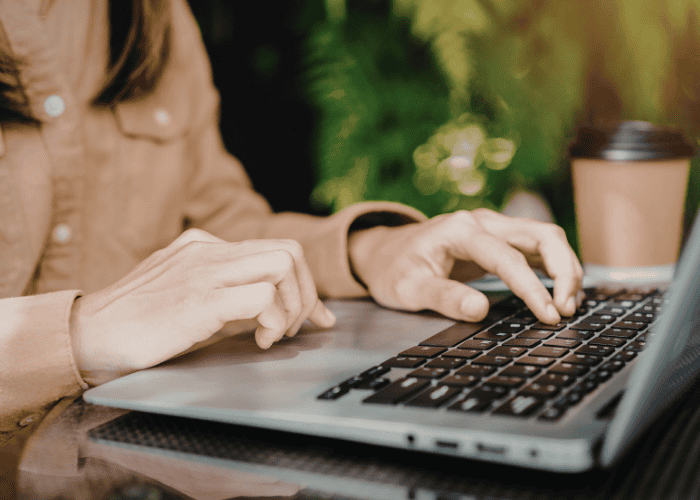 Mom using laptop to read parent reviews and testimonials