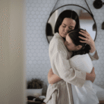 Mom hugging teen daughter needing support with what parents can expect emotionally