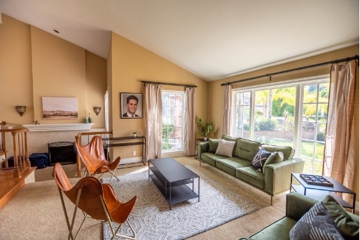 A peaceful, well-furnished common area inside a Mission Prep Healthcare licensed group home, with warm lighting, comfortable seating, and a homelike atmosphere designed for adolescent mental health recovery.