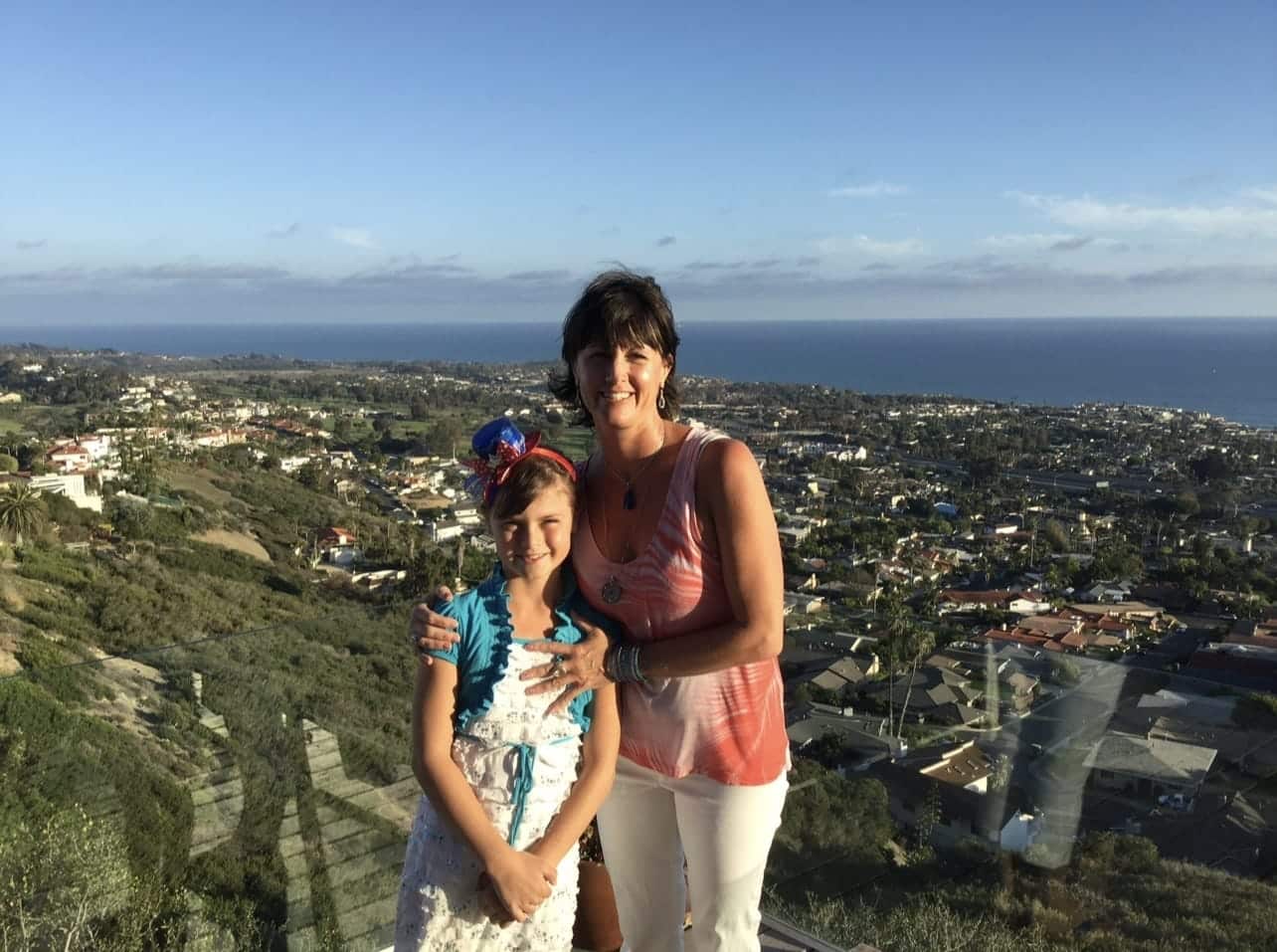 Jade and Mom standing in front of a vista