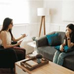 Teenage girl in therapy room talking about her identity after trauma