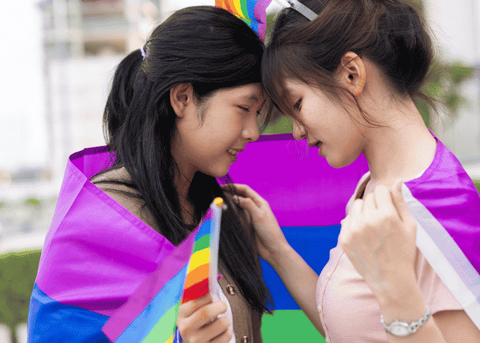two girls wearing flags not struggling with LGBTQ+ Teen Depression and Anxiety