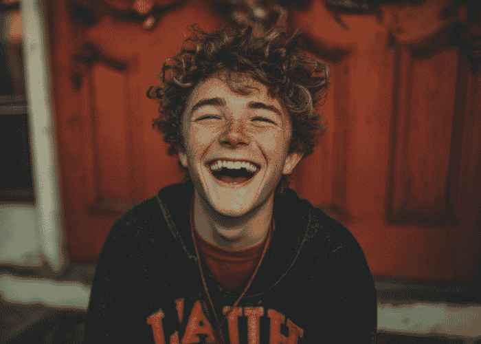 teenage boy smiling after Long-Term Self-Concept Outcomes