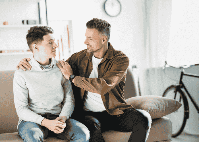 Teenage boy with father, no longer wondering 'Will my teen feel abandoned in treatment?'