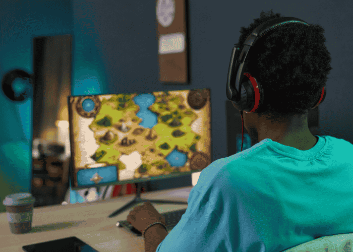 Child playing game on PC, exposed to signs of online grooming