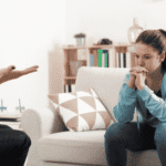 Teenage girl sitting during outpatient mental health treatment for teens