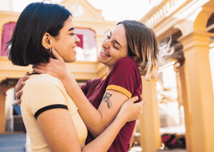 Teen girls smiling after support with sexual identity development in teens