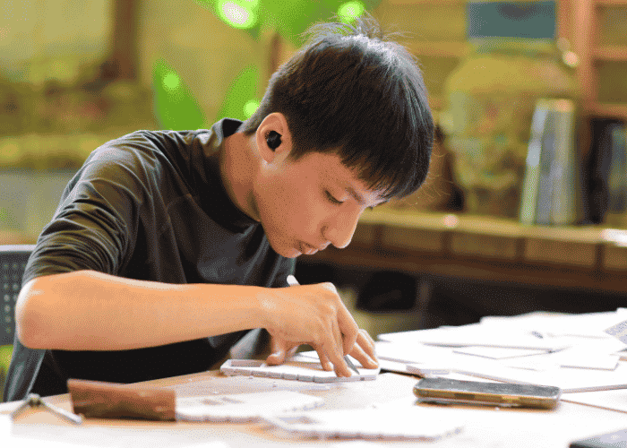Neurodivergent teen at school concentrating, Neurodivergent vs Neurotypical