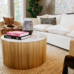 Comfortable living room setup in Mission Prep’s facility with white and brown sofas and a wooden center table